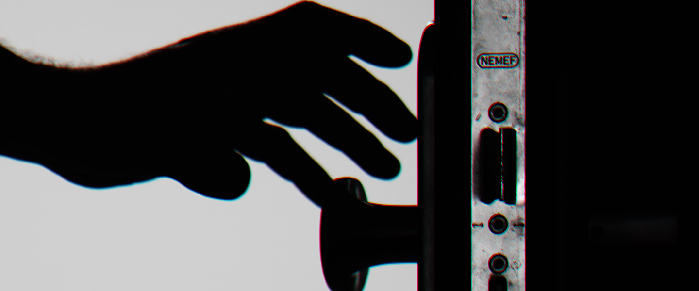 Person reaching for door knob